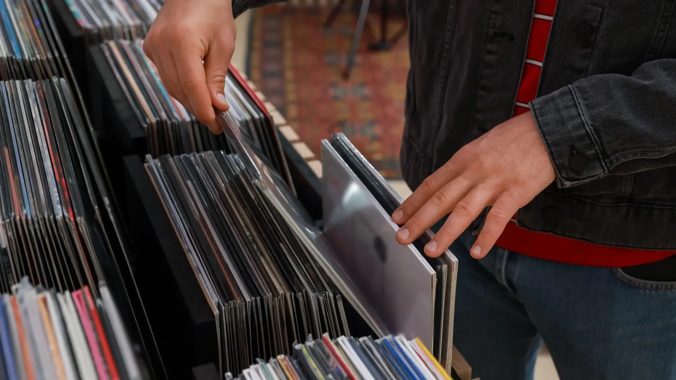 Limited-edition colored vinyl records fanned out on a table after a Record Store Day haul